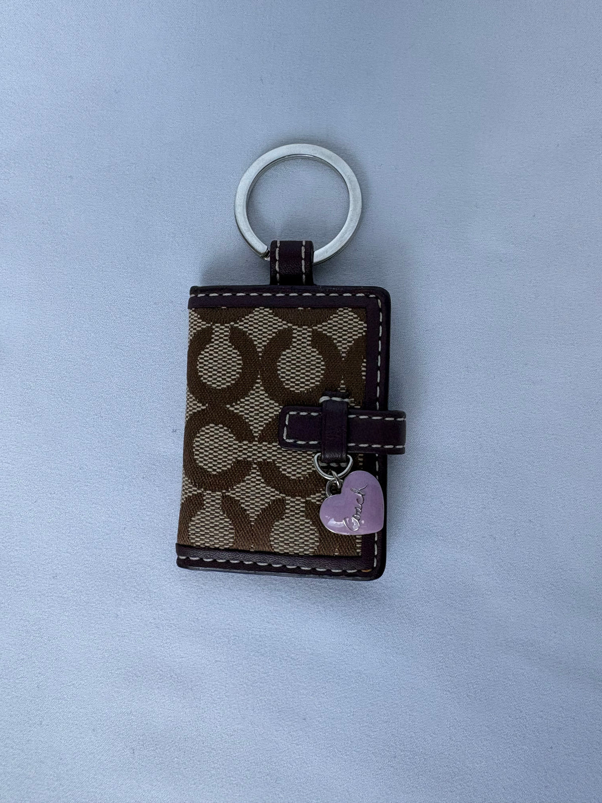 Coach monogram photo album keychain