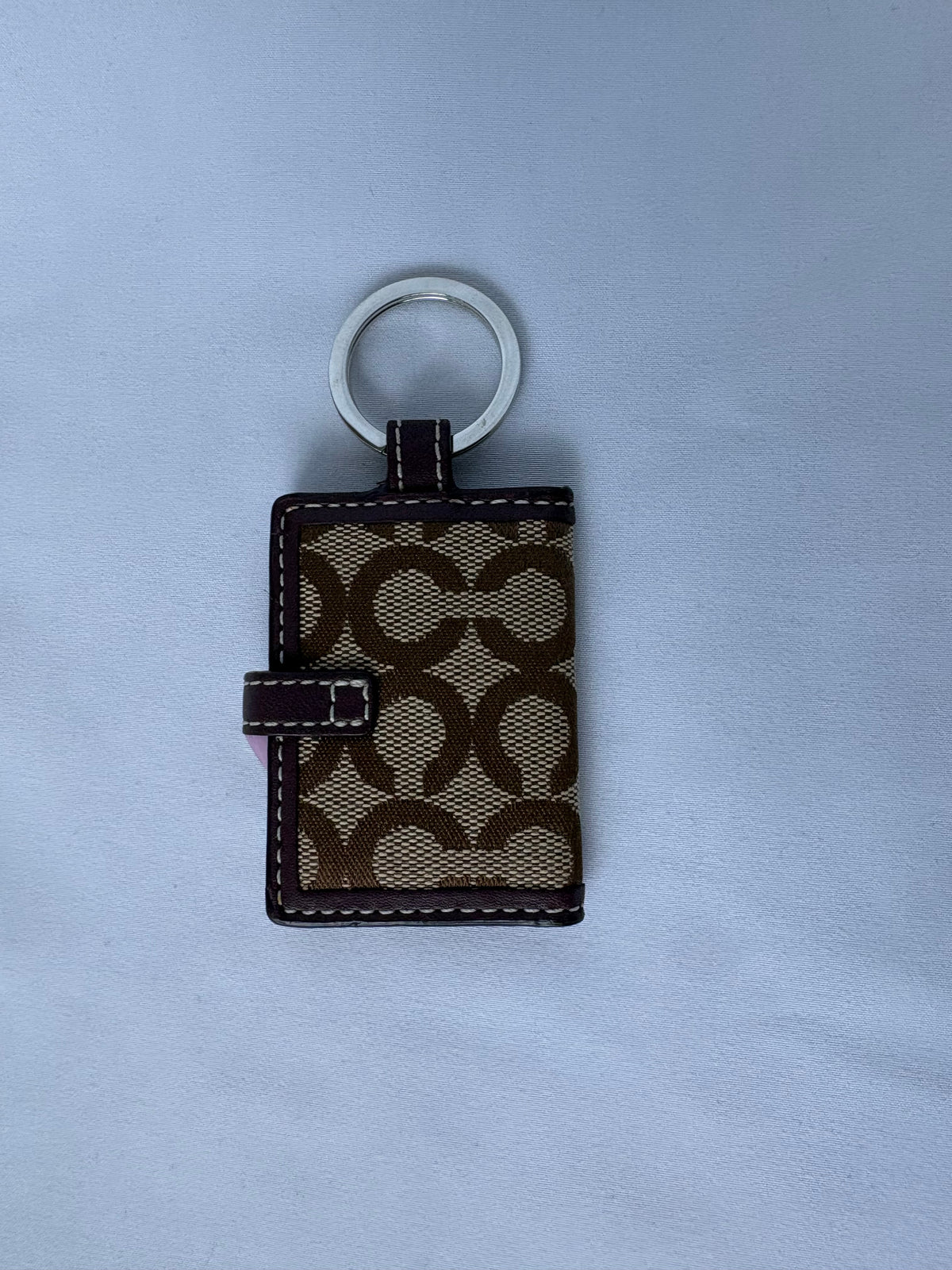 Coach monogram photo album keychain
